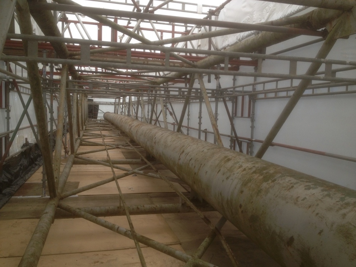 Scaffold access structure around pipework inside a utility installation Scaffold access structure around pipework inside a utility installation