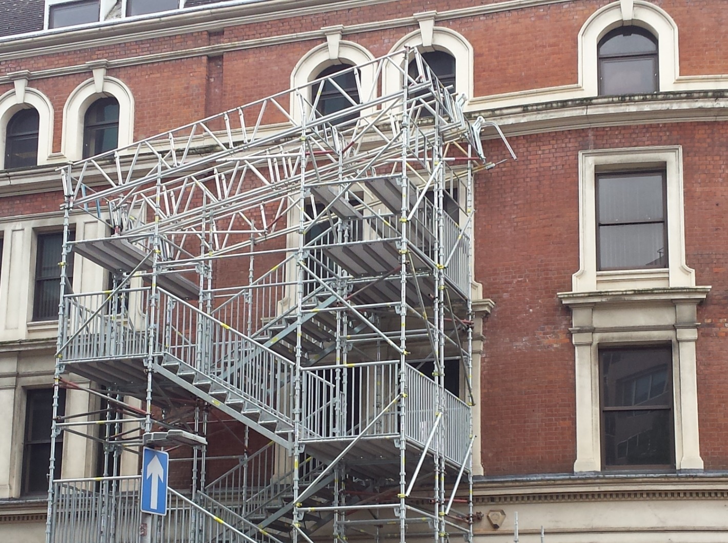 Public access staircase scaffold beside a building Public access staircase scaffold beside a building